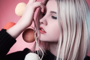 Beauty shot of woman in winter makeup look and cosy black sweater